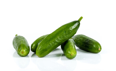 Freshly harvested mini cucumber on isolated white background