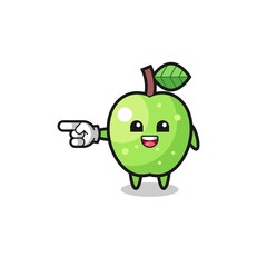 green apple cartoon with pointing left gesture