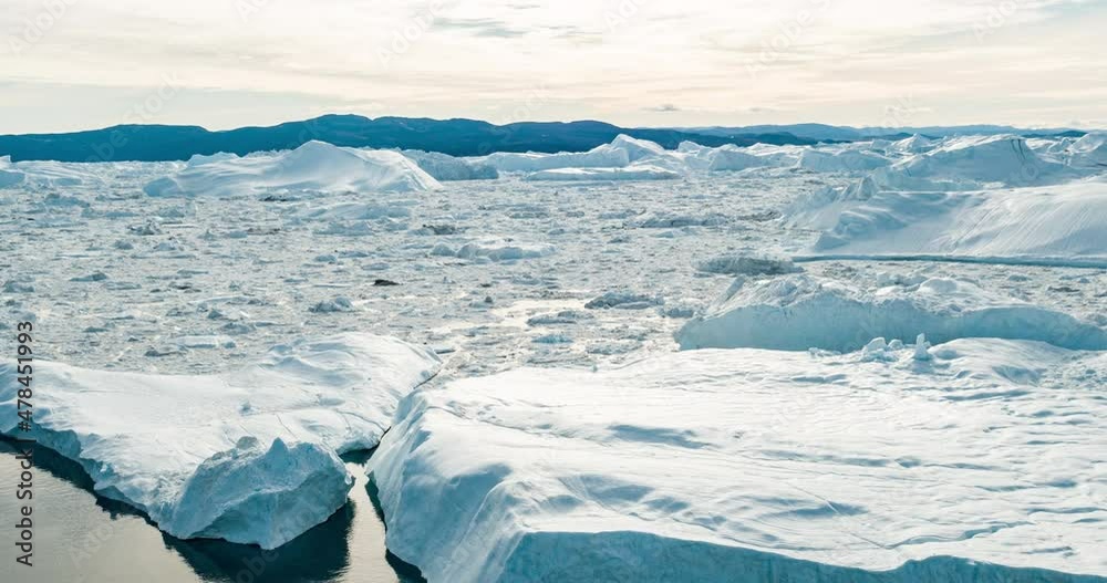 Wall mural global warming and climate change - icebergs from melting glacier in icefjord