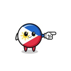 Fototapeta premium philippines flag mascot with pointing right gesture
