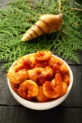 Asian street foods, spicy roasted prawns and shrimps coated with spices and herbs.