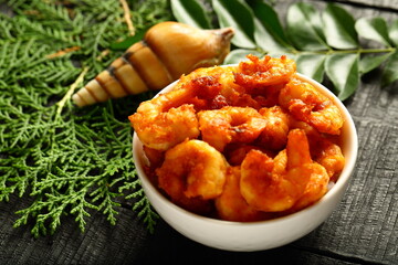 Crispy fried prawns and shrimps, Kerala seafood recipes background.