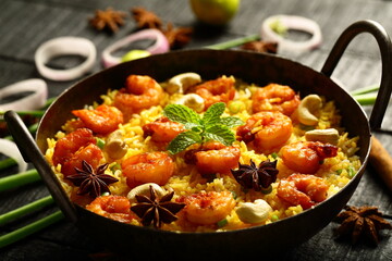 Homemade delicious seafood biriyani, biryani cooked in iron skillet. 