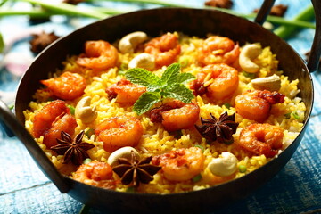 Homemade delicious seafood biriyani, biryani cooked in iron skillet. 