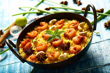 Traditional Seafood biryani cooked in iron skillet, 