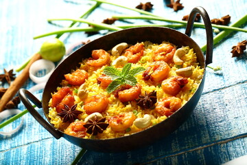 Traditional Seafood biryani cooked in iron skillet, 