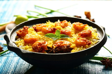 Indian street foods background- delicious seafood biryani cooked with prawns and shrimps.
