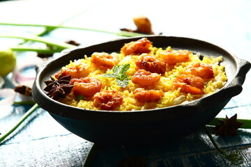 Indian street foods background- delicious seafood biryani cooked with prawns and shrimps.