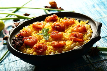 Indian street foods background- delicious seafood biryani cooked with prawns and shrimps.