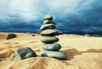 Stacking Stones on Beach