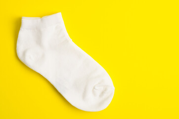 White socks on yellow background