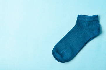 Blue socks on blue background and space for text.