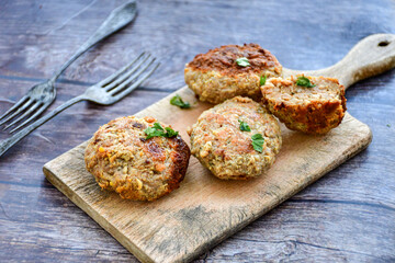 Home made  fried meatballs   on wooden rustic background.Cutlets from beef and pork meat.