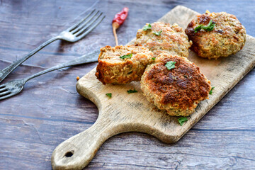 Home made  fried meatballs   on wooden rustic background.Cutlets from beef and pork meat.
