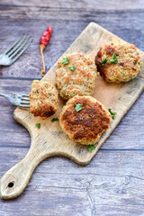 Home made  fried meatballs   on wooden rustic background.Cutlets from beef and pork meat.