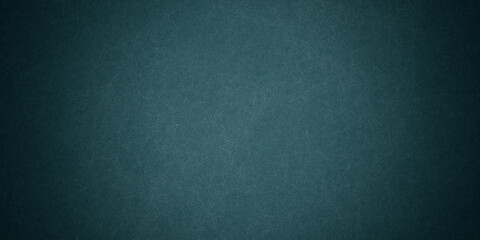 Dark blue background texture with black vignette in old vintage grunge textured border design, dark elegant teal color wall with light spotlight center
