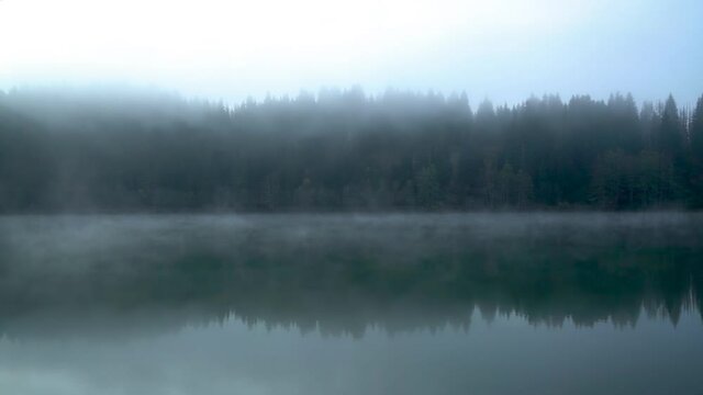 Savsat Karagol Black lake in Eastern Black Sea with morning evaporation. Savsat Karagol lake is a large trout lake in the forest in Savsat, Artvin, Turkey