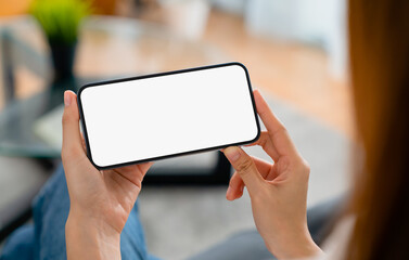 Hand holding smartphone mockup of blank screen. Take your screen to put on advertising.