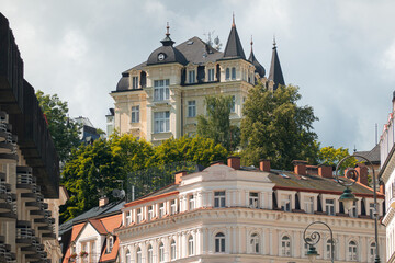 Obraz premium Travel to Karlovy Vary from Czech Republic, 2021. View to the beautiful landmarks architecture old buildings of this city in a beautiful sunny day. 