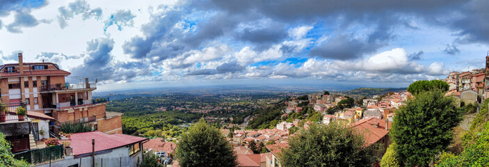 Overview from the panoramic terrace of Rocca di Papa a look towards countryside and Rome with a fantastic cloudy sky and dramatic light, Italy.