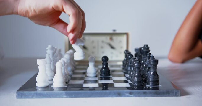 Using a chess clock during a blitz chessboard game, blitzkrieg chessboard tournament, still shot