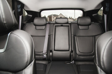 Back passenger seats in modern luxury car, frontal view