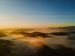 aerial view of sunrise above mountain range