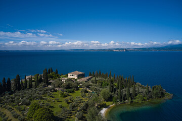 Aerial view of Parco Baia delle Sirene, Lake Garda, Italy. Top view of baia delle sirene on the coastline of Lake Garda. Panorama of punta san vigilio.