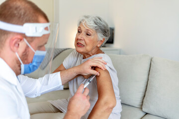 Prevention and immunization from coronavirus infection. Immunization and vaccination for flu shot, hpv or COVID-19 prevention with senior woman having vaccine injection for world immunization week.