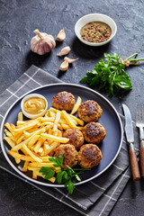 Vitoulet, hot Belgian meatballs with french fries