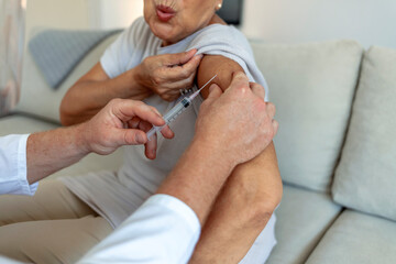 Prevention and immunization from coronavirus infection. Immunization and vaccination for flu shot, hpv or COVID-19 prevention with senior woman having vaccine injection for world immunization week.