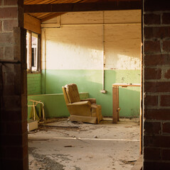 Lounge chair in abandoned farm house, Australia