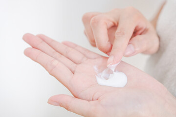 Woman applying natural cream, Woman moisturizing her hand with cosmetic cream, Spa and Manicure concept.