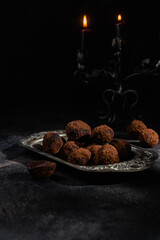 Dark chocolate truffle on dark background
