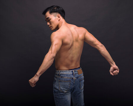 Young man showing his muscular back