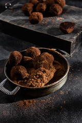 Dark chocolate truffle on dark background