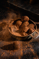 Dark chocolate truffle on dark background