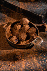 Dark chocolate truffle on dark background