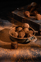 Dark chocolate truffle on dark background