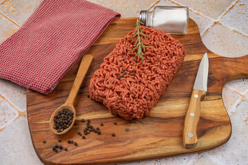 raw beef ground meat, closeup, on a table