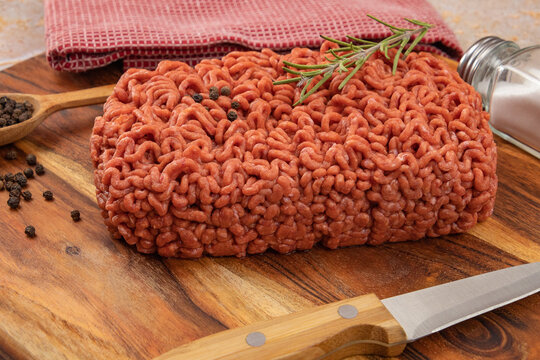 raw beef ground meat, closeup, on a table