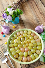 Holiday food, easter salad. Salad with chicken, cheese, walnuts and grapes on a festive table. Copy space.