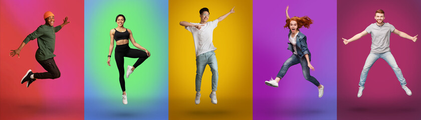 Expressing joy and happiness. Full length of active energetic young men and women jumping over neon color backgrounds