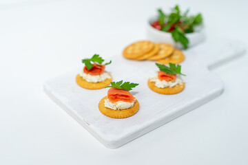 cracker  with cheese and  salmon on the white background