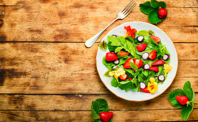 Summer salad with berries and herbs