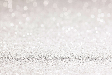 sparkles of Silver glitter abstract background. Copy space