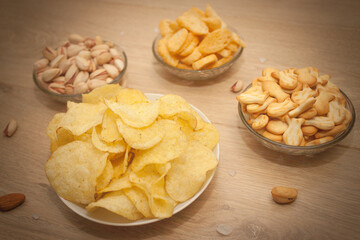 Nuts and snacks, a snack for beer on a light background.