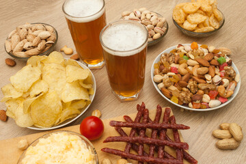 Nuts and snacks, a snack for beer on a light background.