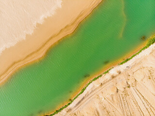 Emerald lake aerial view. Abstract fantasy green and yellow pattern background.