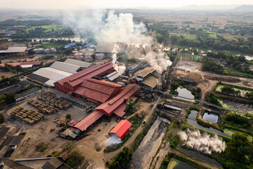 Sugar bioethanol translation factory working with steam from the chimney and sugarcane truck